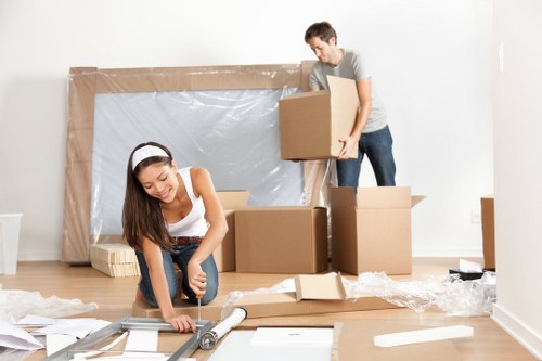 Movers Hampstead team sorting recyclable packing materials during a sustainable house move
