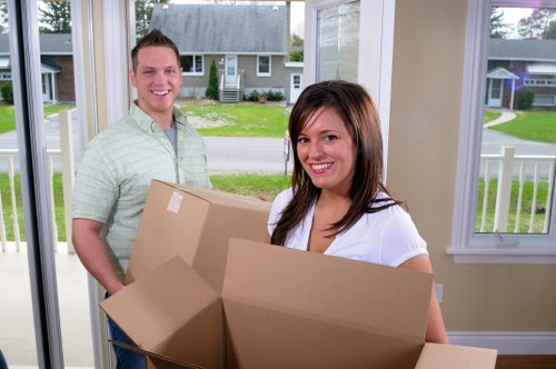 Mover using safe manual handling techniques with protective gear