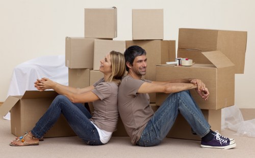 Assorted packing supplies including tape, wrap, and cartons for local removals