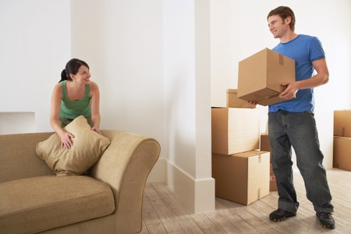 Packed boxes and furniture ready for local removal services