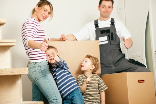 Packed moving boxes and furniture for a Hampstead home removal